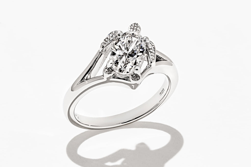 Custom sea turtle diamond engagement ring with oval cut lab diamond set in 14k white gold